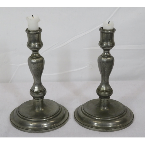 324 - Pair of vintage pewter baluster shaped candlesticks with round stepped bases