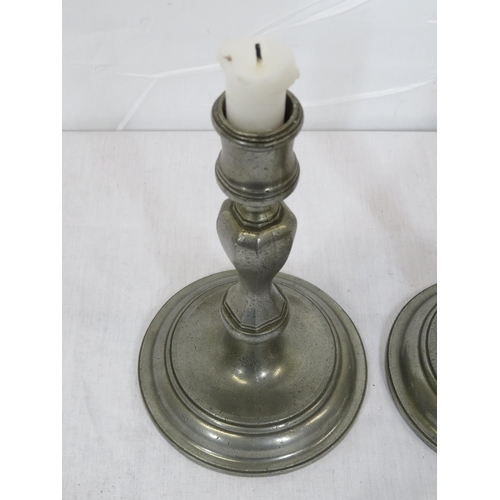 324 - Pair of vintage pewter baluster shaped candlesticks with round stepped bases