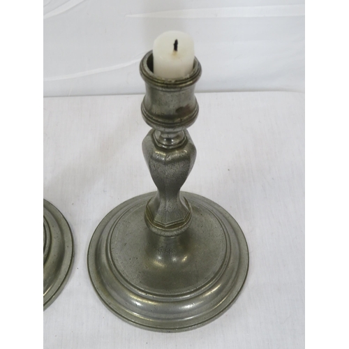 324 - Pair of vintage pewter baluster shaped candlesticks with round stepped bases