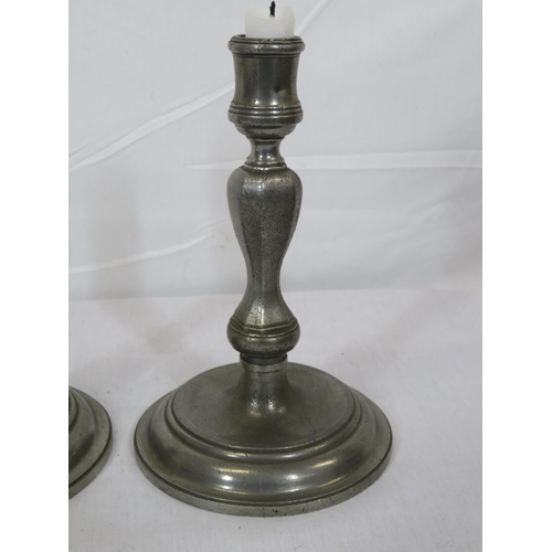 324 - Pair of vintage pewter baluster shaped candlesticks with round stepped bases