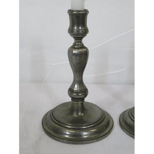 324 - Pair of vintage pewter baluster shaped candlesticks with round stepped bases