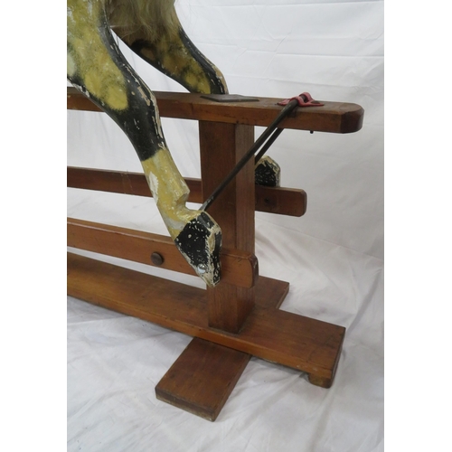 325 - Edwardian painted rocking horse with upholstered saddle & bridle, on timber base, by J Collinson & S... 