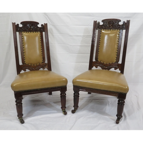 346 - Pair of Victorian bath side chairs with leatherette upholstery, foliate carving, on turned legs