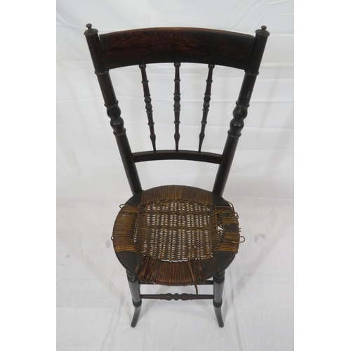 357 - Arts & Crafts high chair with turned spindles, wicker seat, turned legs with stretchers