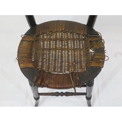 357 - Arts & Crafts high chair with turned spindles, wicker seat, turned legs with stretchers