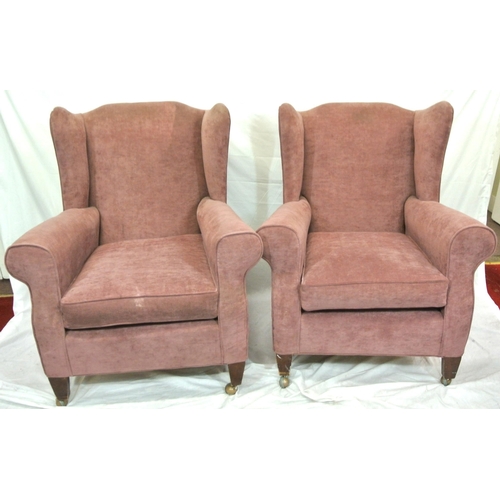 361 - Pair of Georgian upholstered wingback armchairs with shaped arms, cushions, on square tapering legs ... 