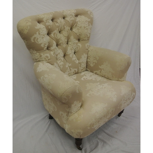 365 - Victorian style large upholstered armchair with buttoned back, on turned tapering legs