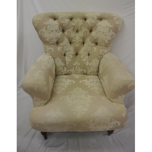 365 - Victorian style large upholstered armchair with buttoned back, on turned tapering legs