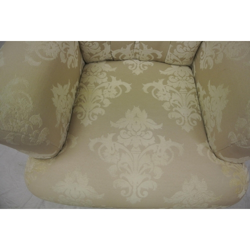 365 - Victorian style large upholstered armchair with buttoned back, on turned tapering legs