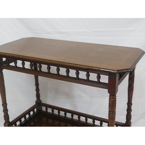 81 - Edwardian mahogany two tier occasional table with turned rails & columns, tapering legs with castors