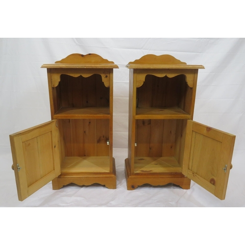 84 - Pair of pine bedside lockers with shaped backs, panelled doors, on bracket feet