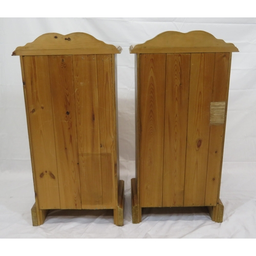 84 - Pair of pine bedside lockers with shaped backs, panelled doors, on bracket feet