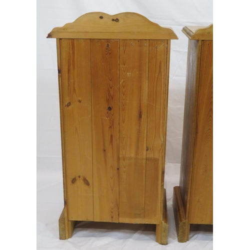 84 - Pair of pine bedside lockers with shaped backs, panelled doors, on bracket feet