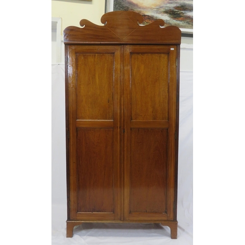 85 - Edwardian inlaid small wardrobe with shaped pediment, panelled doors, fitted with hanging, on bracke... 