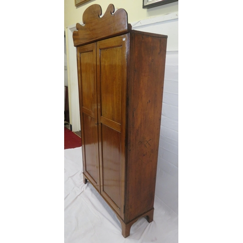 85 - Edwardian inlaid small wardrobe with shaped pediment, panelled doors, fitted with hanging, on bracke... 