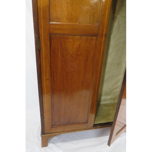 85 - Edwardian inlaid small wardrobe with shaped pediment, panelled doors, fitted with hanging, on bracke... 