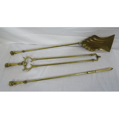 88 - Three brass fire implements with shaped tops