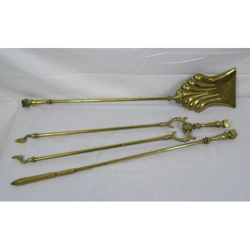 88 - Three brass fire implements with shaped tops