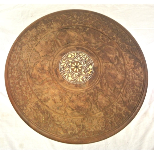 93 - Round Indian occasional table with foliate carving & folding base