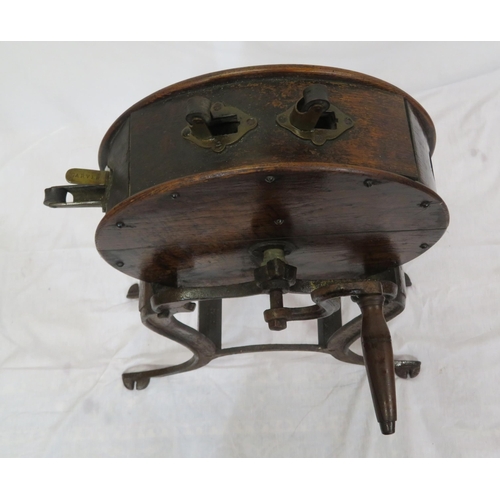 98 - Edwardian timber & cast iron knife sharpener with round top, shaped handles, on cast iron base