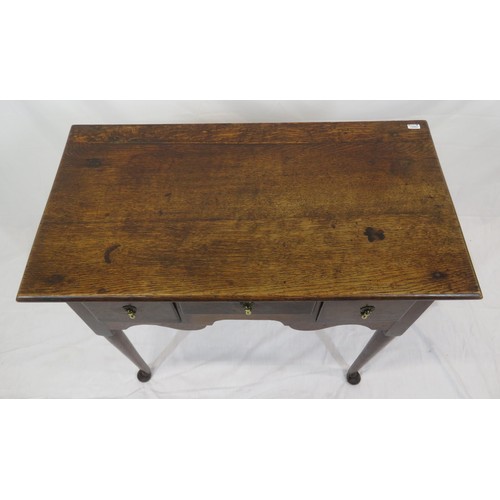 321 - Victorian oak lowboy with three drawers, brass teardrop handles, on cabriole legs with pad feet