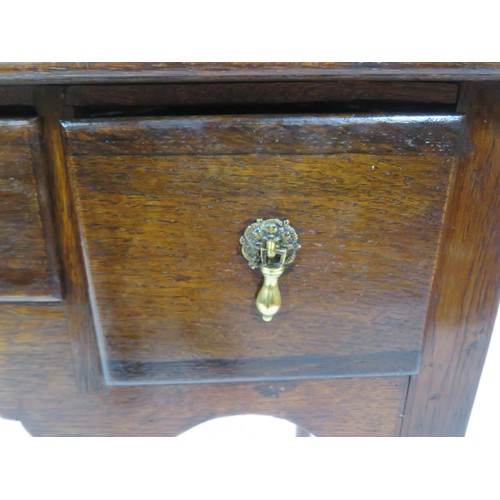 321 - Victorian oak lowboy with three drawers, brass teardrop handles, on cabriole legs with pad feet