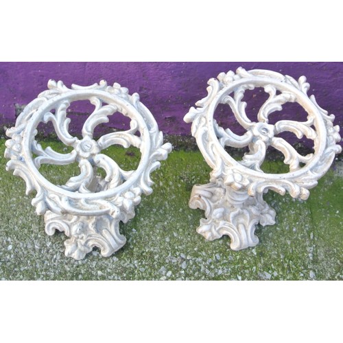 338 - Pair of ornate cast iron jardiniere stands with foliate decoration and shaped bases