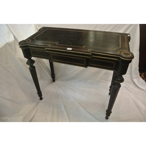 160 - French Empire style ebonised card table with fold-over top, brass inlay, 'dog-ear' candle corners, r... 