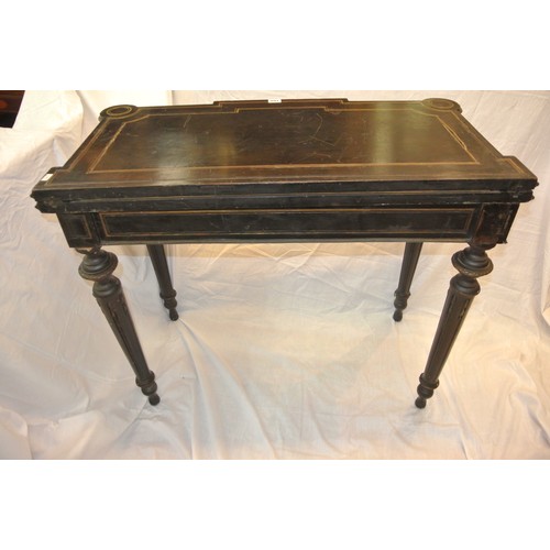 160 - French Empire style ebonised card table with fold-over top, brass inlay, 'dog-ear' candle corners, r... 