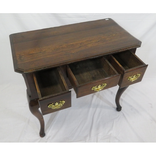 186 - Georgian oak lowboy with three frieze drawers, brass drop handles with shaped backplates, on cabriol... 