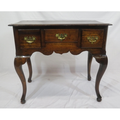 186 - Georgian oak lowboy with three frieze drawers, brass drop handles with shaped backplates, on cabriol... 