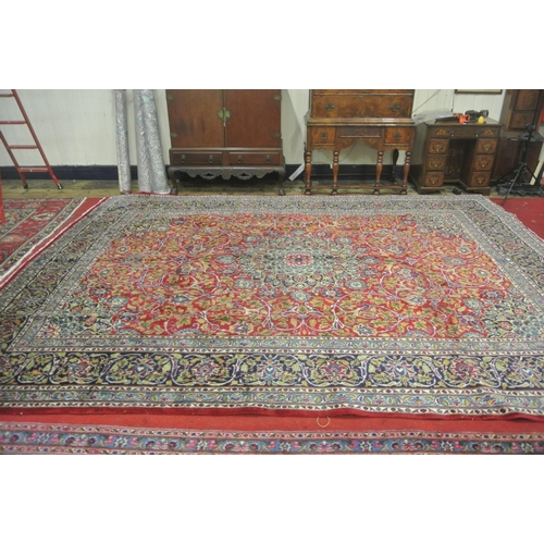 281 - Large red ground Persian Kashan carpet with Lozengier Medallion design