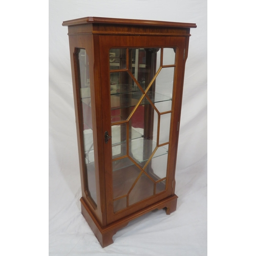 111 - Edwardian design yew bookcase with astragal glazed door, glass shelving, on bracket feet