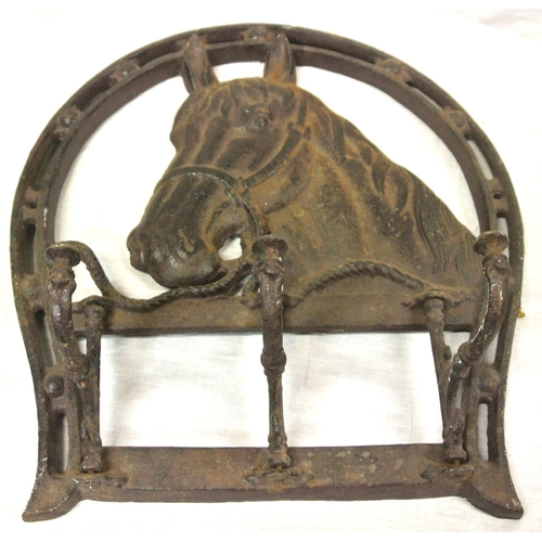 117 - Horse-shoe shaped cast iron hat or coat rack with horse head insert