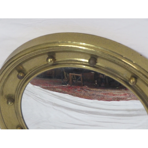 137 - Regency design gilt framed convex mirror with ball decoration