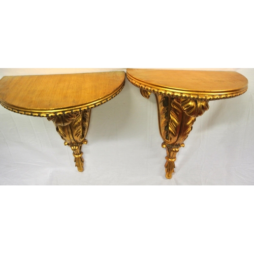 148 - Pair of Regency design gilt demi-lune timber wall brackets with foliate decoration