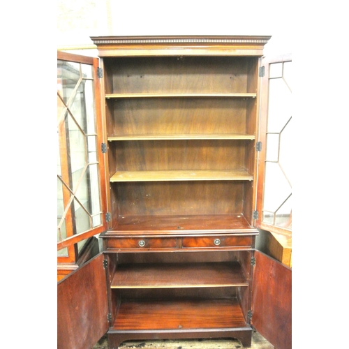 155 - Edwardian design bookcase with dentil frieze, astragal glazed doors, shelved interior, two drawers, ... 