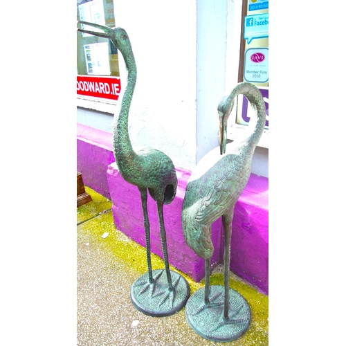 202 - Pair of tall metal garden crane statues on round bases