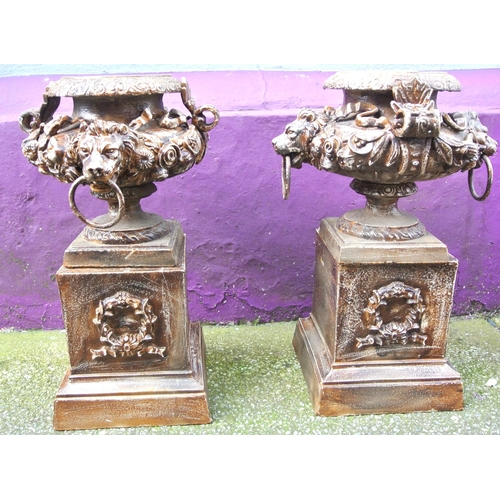 204 - Pair of Victorian style cast iron 'Lion head' garden urns with ornate foliate decoration and handles... 