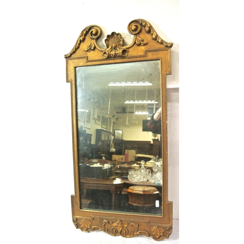 229 - Regency design gilt framed oblong wall mirror with scroll and foliate decoration