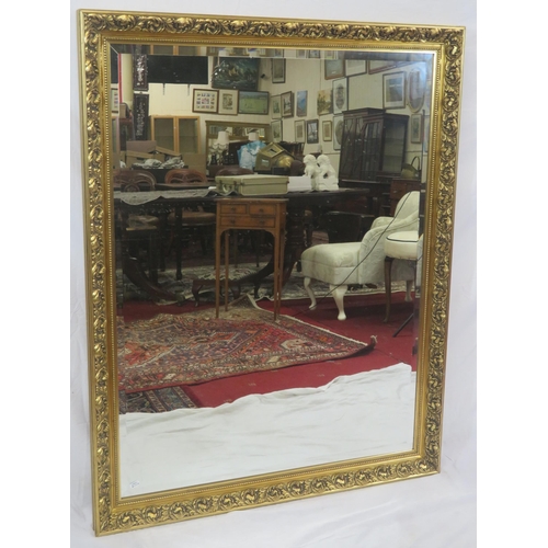 244 - Large Regency design gilt framed bevelled glass mirror with scroll and foliate decoration