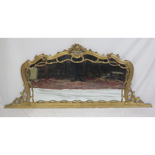 254 - Regency style gilt overmantle with scroll shaped frame an foliate decoration