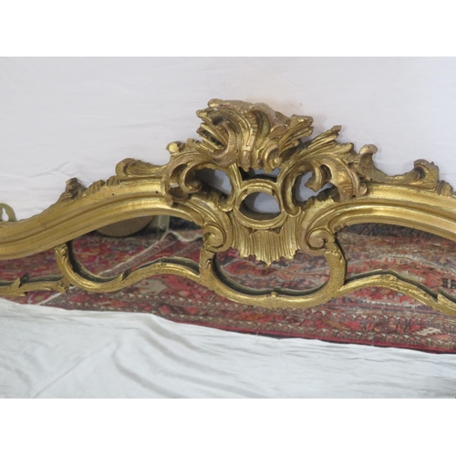 254 - Regency style gilt overmantle with scroll shaped frame an foliate decoration