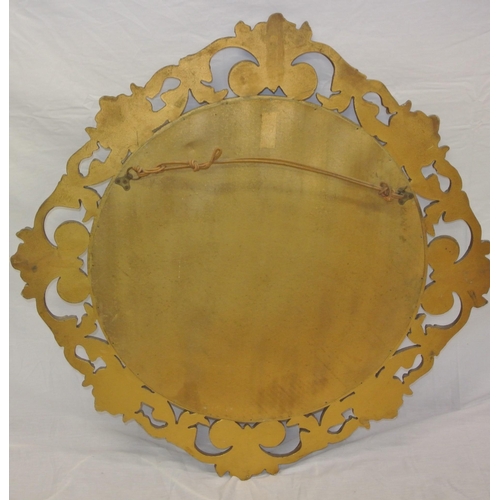 257 - Regency style round gilt framed convex mirror with ornate scroll and foliate decoration