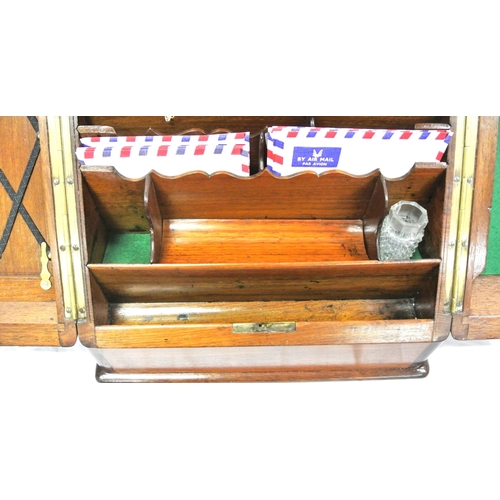 272 - Edwardian mahogany stationery box with fold out doors and lid, fitted interior with date apertures