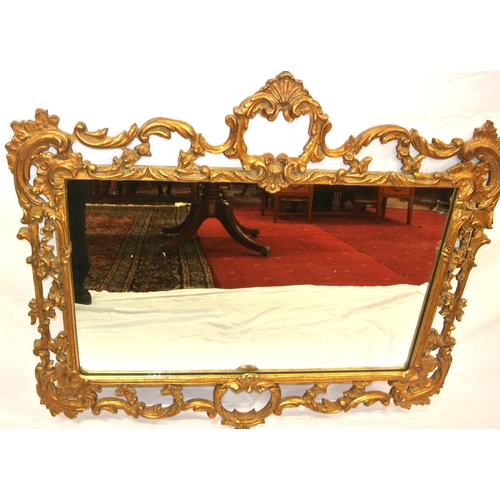 273 - Regency design gilt framed wall mirror with ornate foliate, shell and scroll decoration