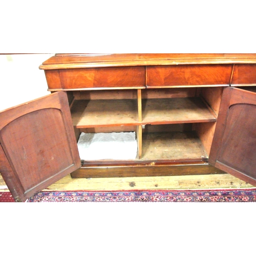 285 - Victorian mahogany triple bookcase with shaped frieze, glazed doors with shelved interior, drawers u... 