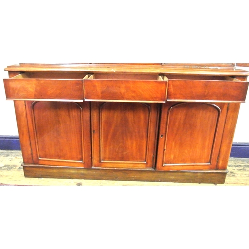 285 - Victorian mahogany triple bookcase with shaped frieze, glazed doors with shelved interior, drawers u... 