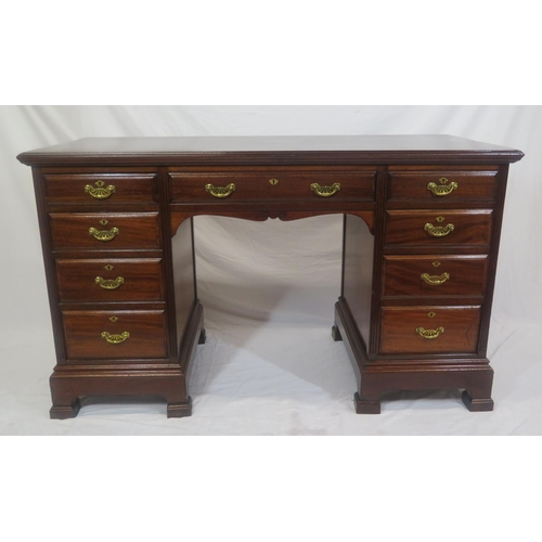 310 - Edwardian mahogany kneehole desk with 9 drawers, brass drop handles with pierced backplates, on brac... 