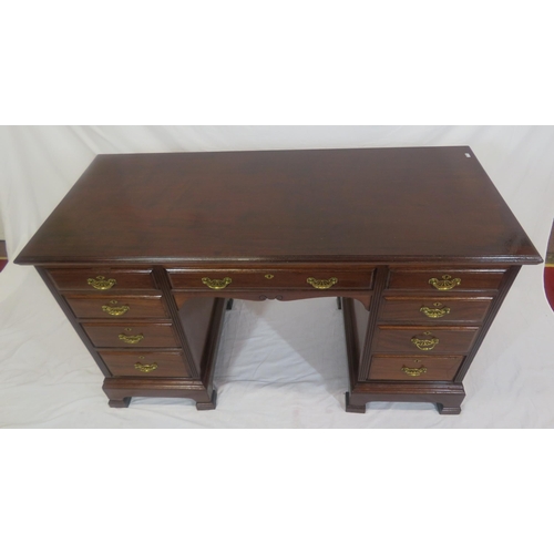 310 - Edwardian mahogany kneehole desk with 9 drawers, brass drop handles with pierced backplates, on brac... 